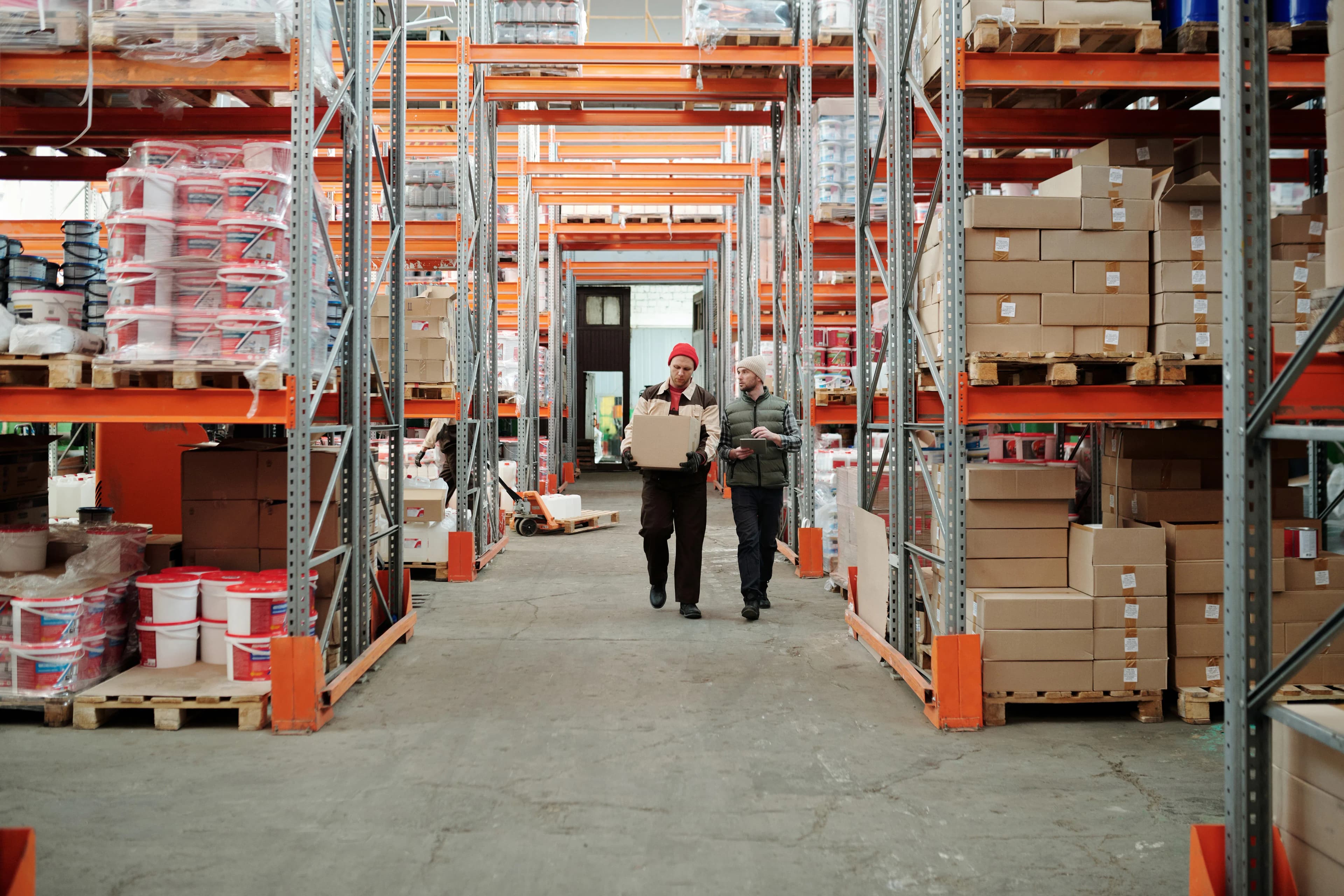 Freight logistics team handling export cargo at a Lagos warehouse before international shipment